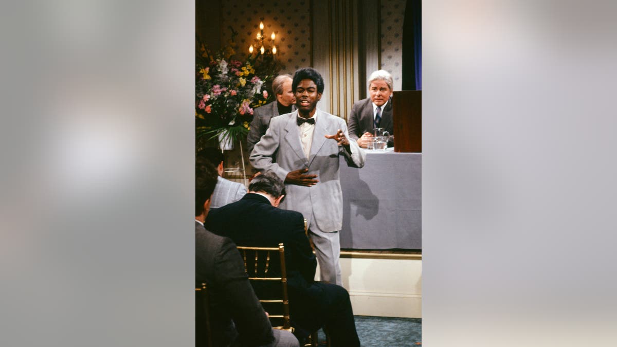 Dana Carvey, Chris Rock and Phil Hartman perform in character during Saturday Night Live.