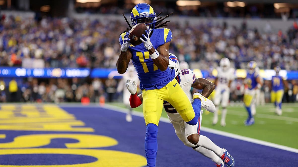 Davante Adams catches a touchdown pass against C.J. Gardner-Johnson during an NFL game.