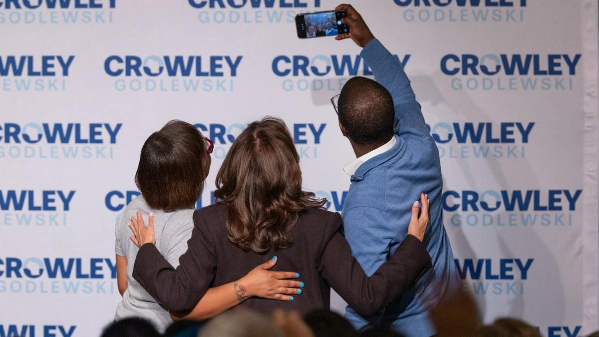 Wisconsin gubernatorial candidate David Crowley snaps a selfie with his wife Ericka and former Vice President Kamala Harris.