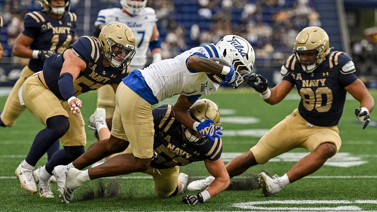 David Wells Jr. dives for a touchdown catch at Navy-Marine Corps Memorial Stadium.