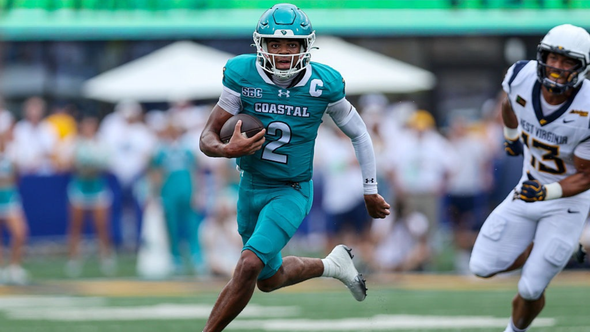 Deuce Bailey runs with the football during a college football game in Morgantown, W.Va.