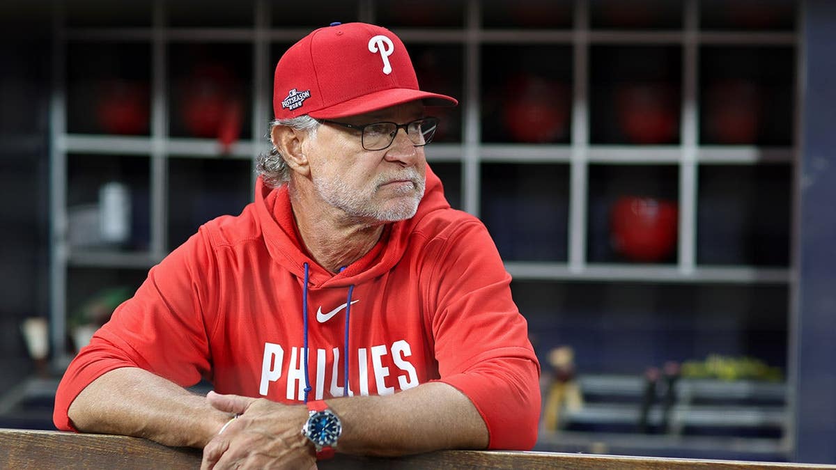 Don Mattingly looks on from the dugout at Truist Park.