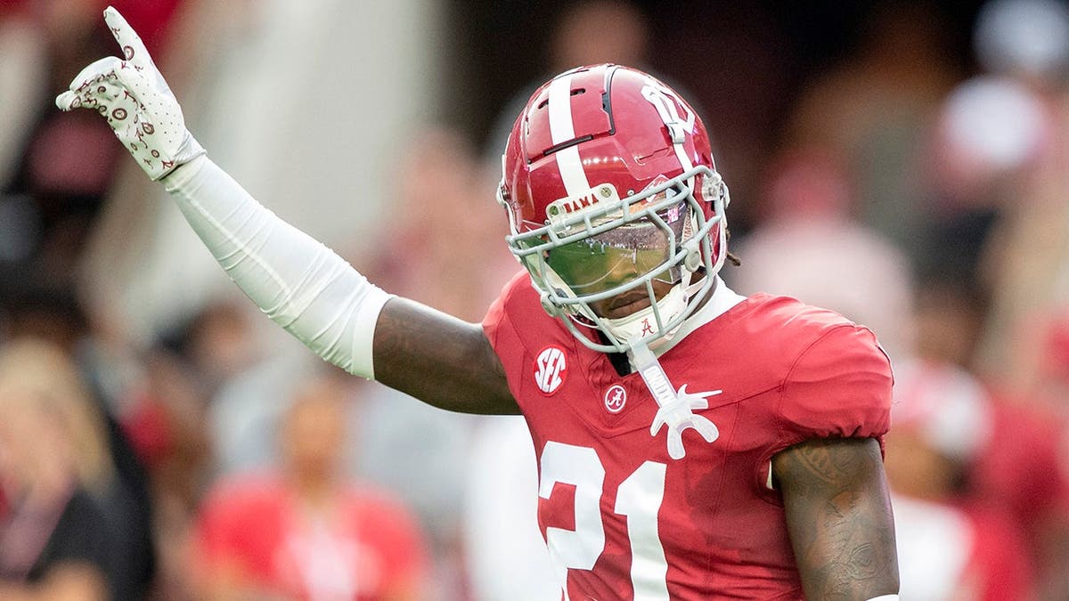 Dre Kirkpatrick Jr. stands on the field before a game at Bryant-Denny Stadium.