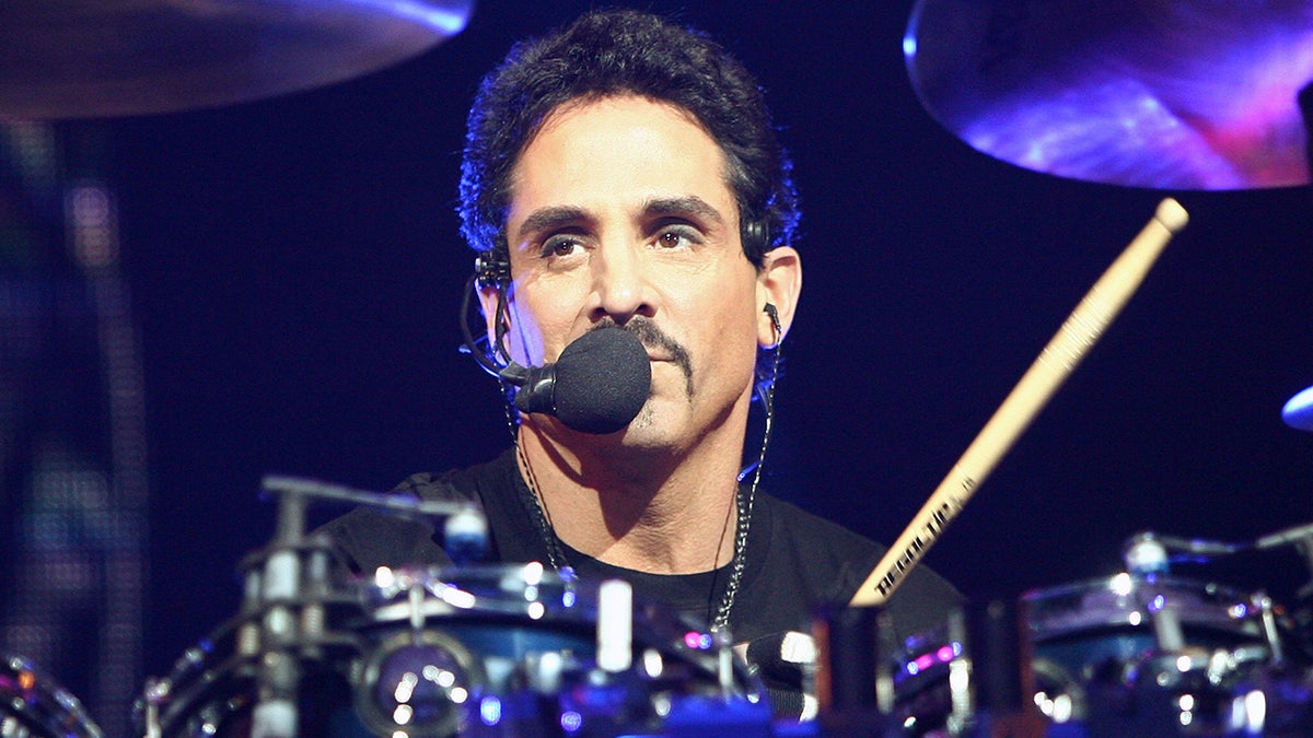 Deen Castronovo plays drums