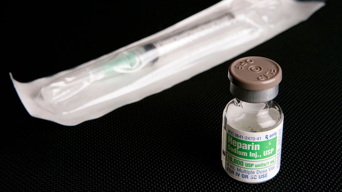 Partially used bottle of heparin and syringe arranged for photograph in Toledo, Ohio.