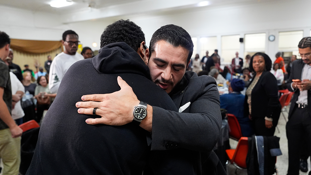 Abdul El-Sayed hugs a supporter