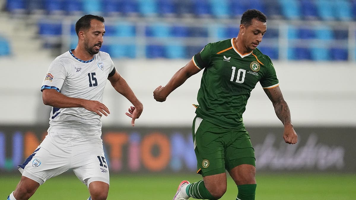 Eliel Peretz guards Adam Idah during a UEFA Nations League soccer match in Backa Topola, Serbia.