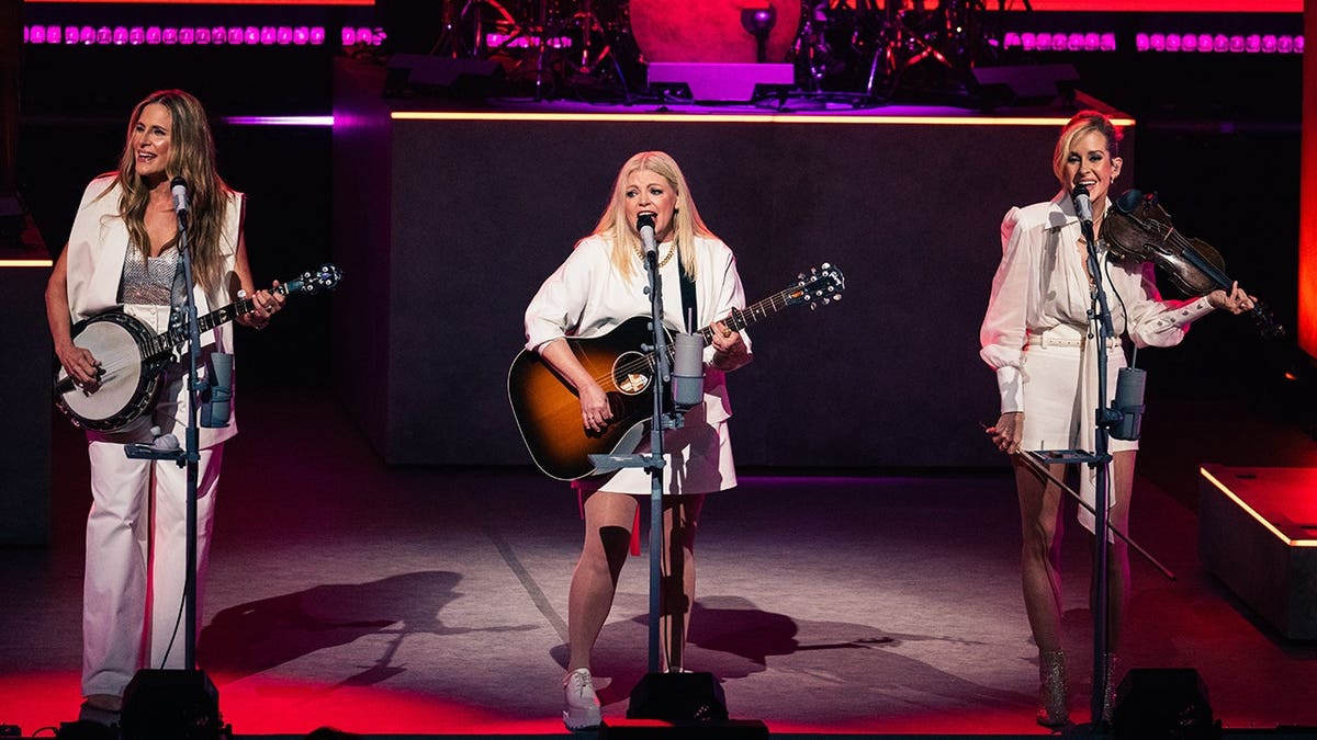 Emily Strayer, Natalie Maines and Martie Maguire stand at The Chicks concert in Los Angeles.