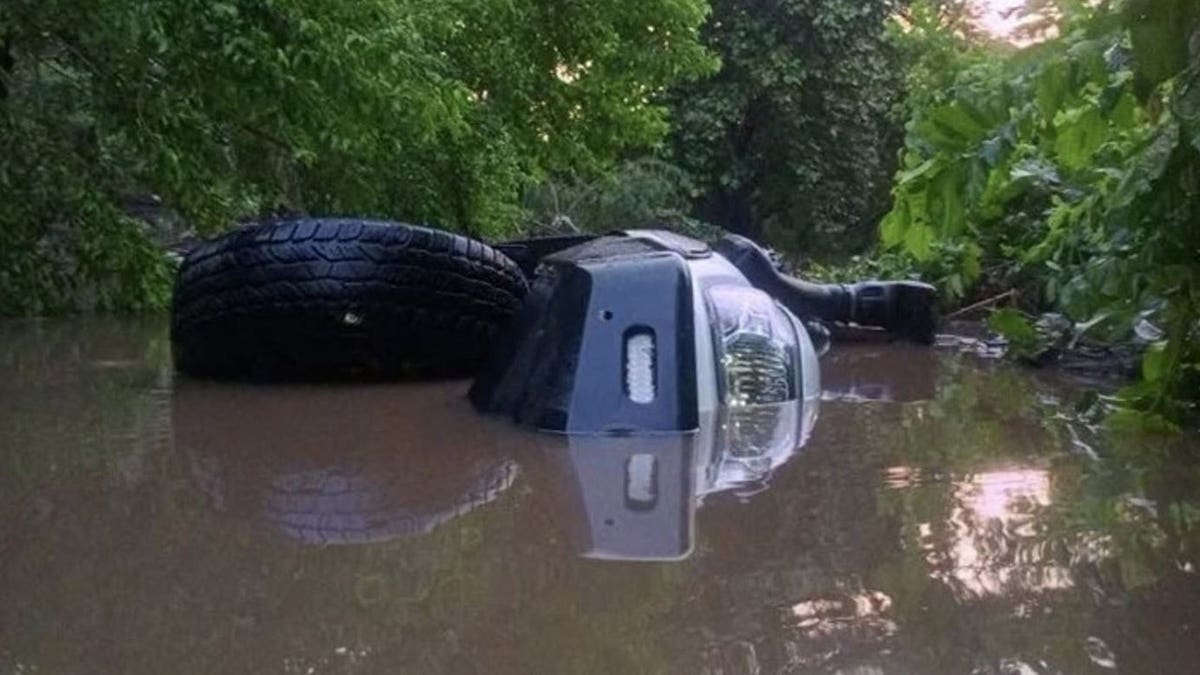Overturned pickup truck after being swept away by swollen river in Nicaragua.