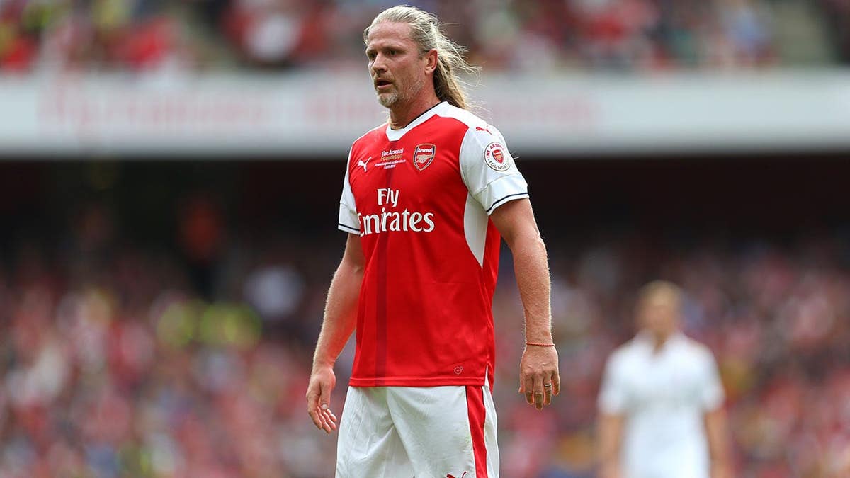 Emmanuel Petit stands during the Arsenal Foundation Charity match at Emirates Stadium.