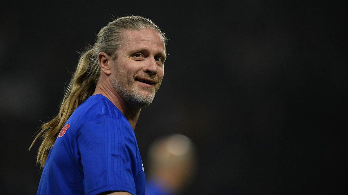 Emmanuel Petit reacts during warmup before a friendly match.