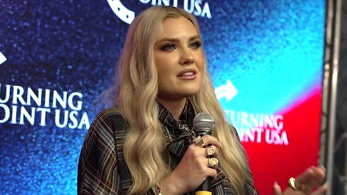 Erika Kirk speaking into a microphone