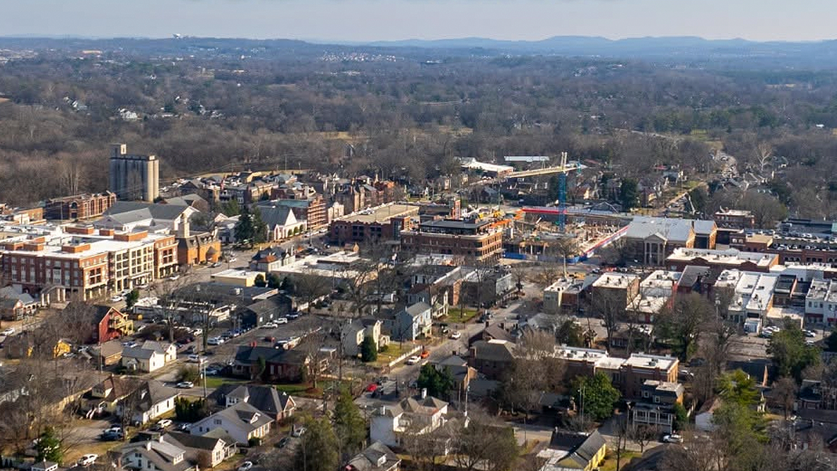 Aerial view of downtown Franklin, Tennessee, showing homes, businesses and surrounding trees