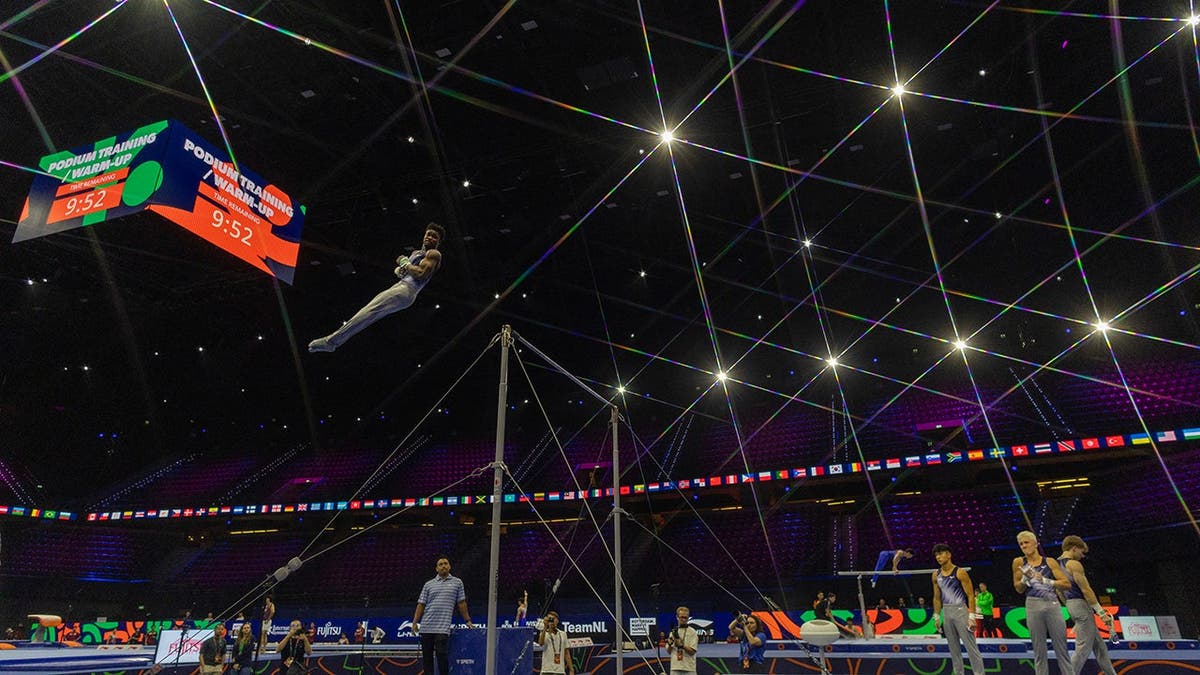 Fred Richard trains on the horizontal bar during podium training.