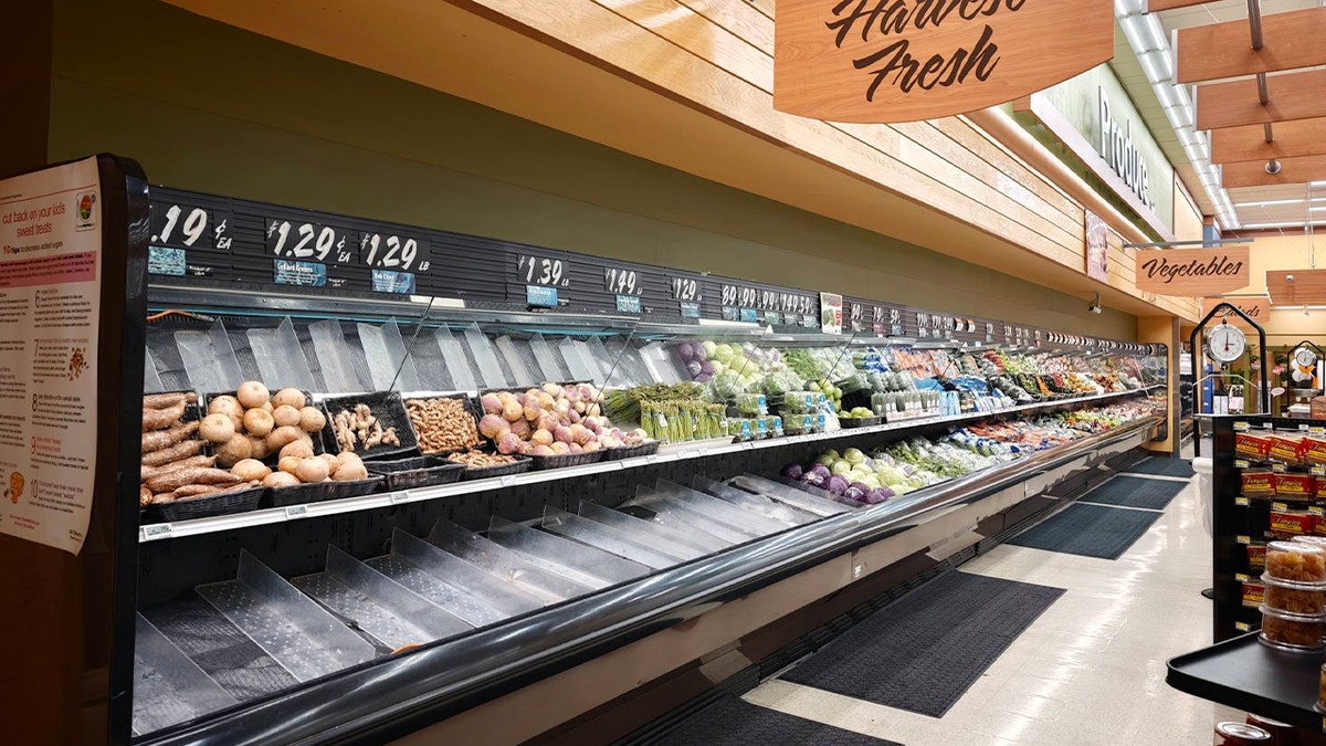 fridge with half of its produce missing