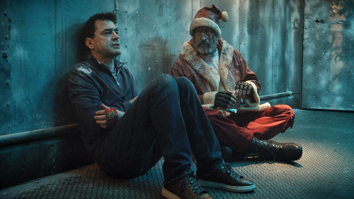 Rob Riggle dressed as Santa in Christmas at the Kringles