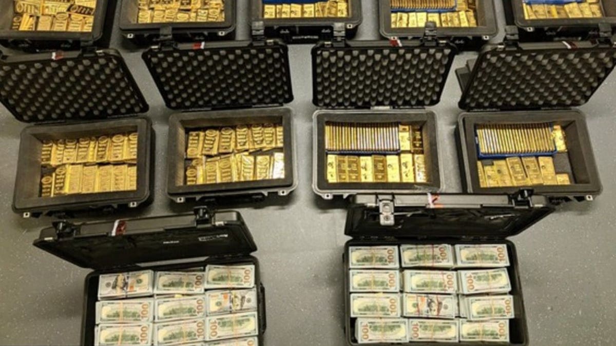 Gold bars and cash in boxes.