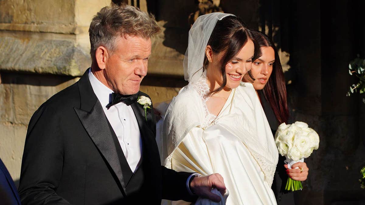 Gordon and Holly Ramsay arrive at Bath Abbey for a wedding.