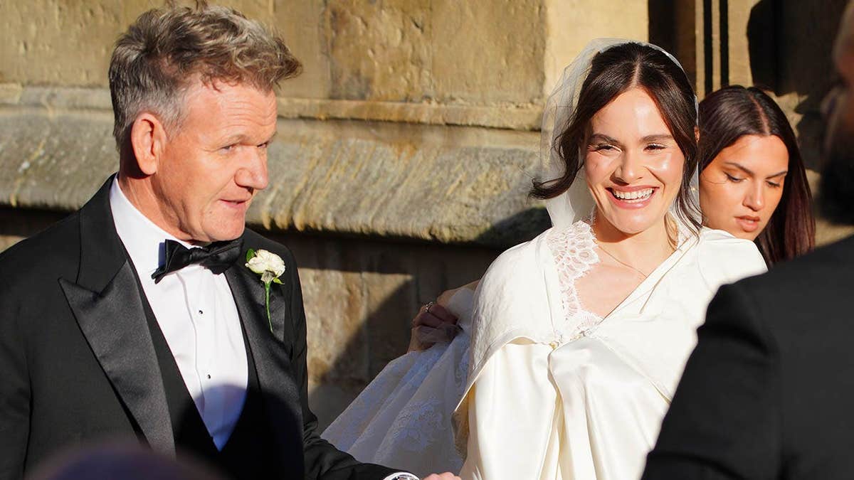 Gordon and Holly Ramsay arrive at Bath Abbey for a wedding.