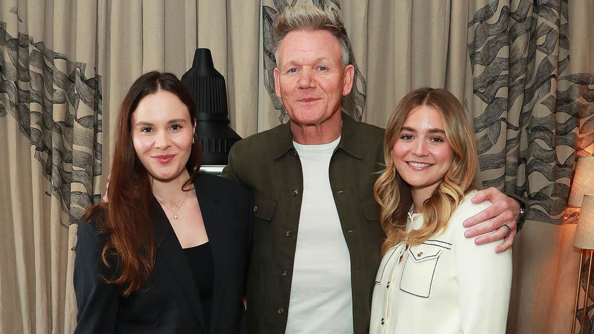 Gordon Ramsay stands with Holly Ramsay Peaty and Tilly Ramsay at an event in London.