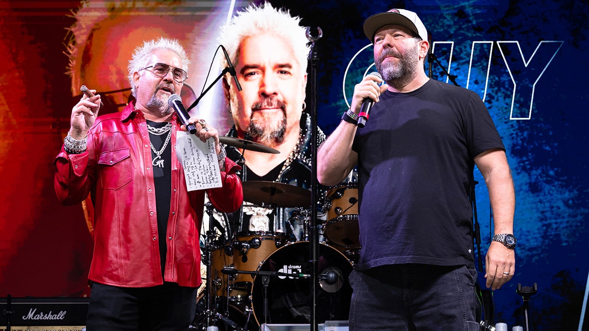 Guy Fieri and Bert Kreischer on stage together.