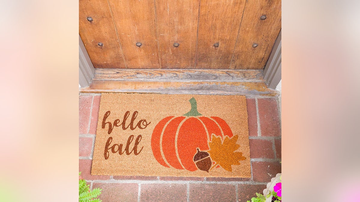 Greet fall with a pumpkin-themed doormat. 