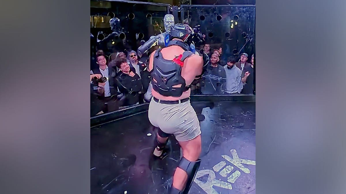 Frankie LaPenna faces a humanoid robot in a cage match.