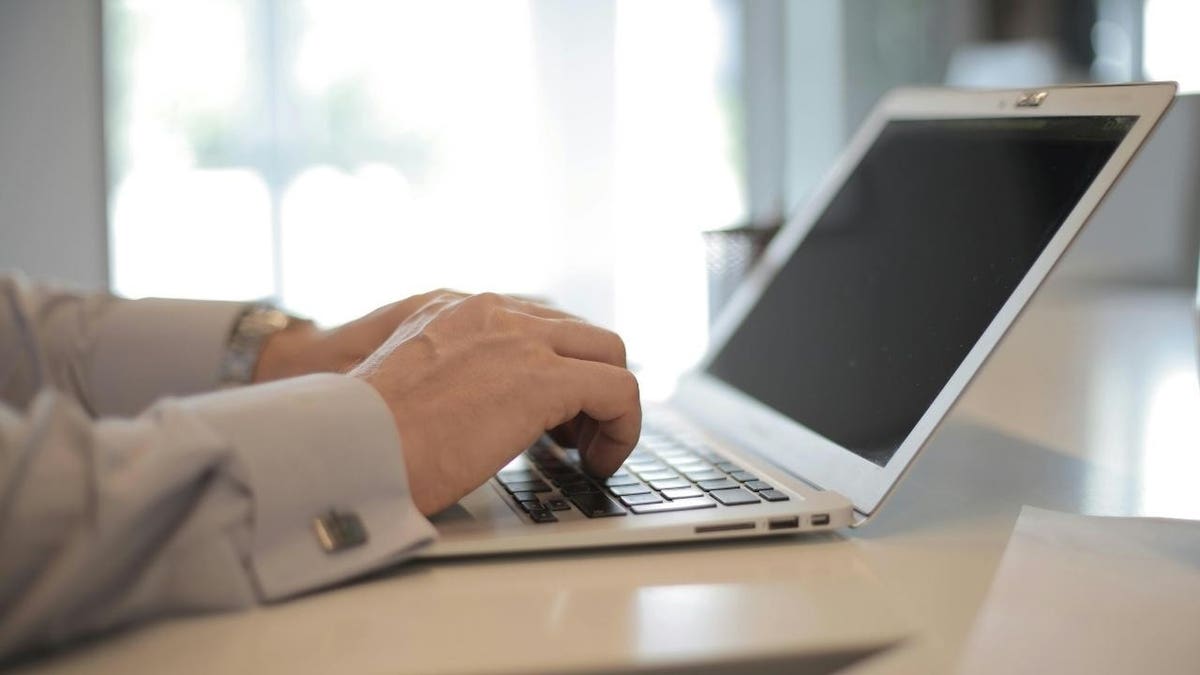 A person typing on a computer