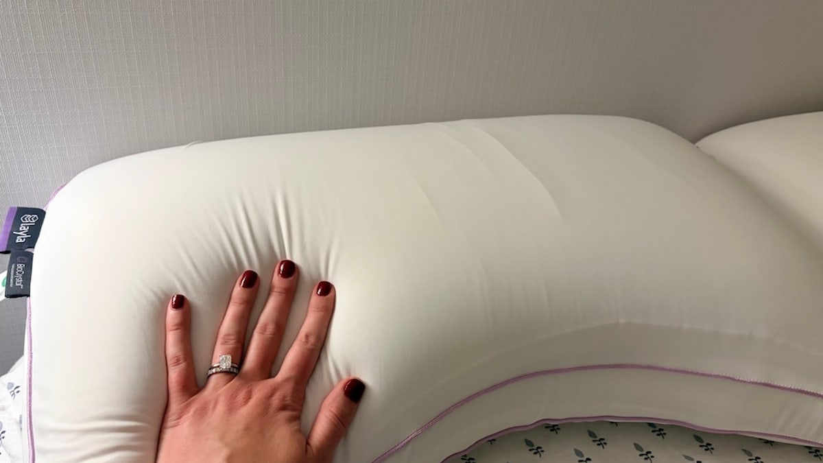 This unique U-shaped pillow helps side sleepers sleep more comfortably. 