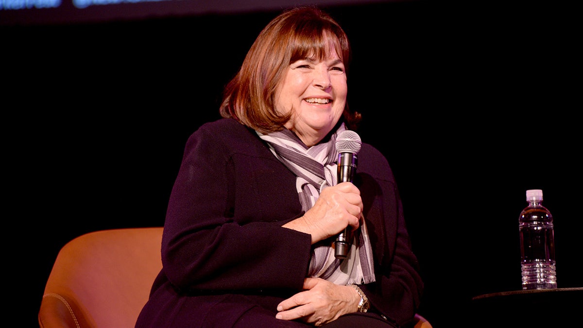 Ina Garten speaking on stage holding mic.