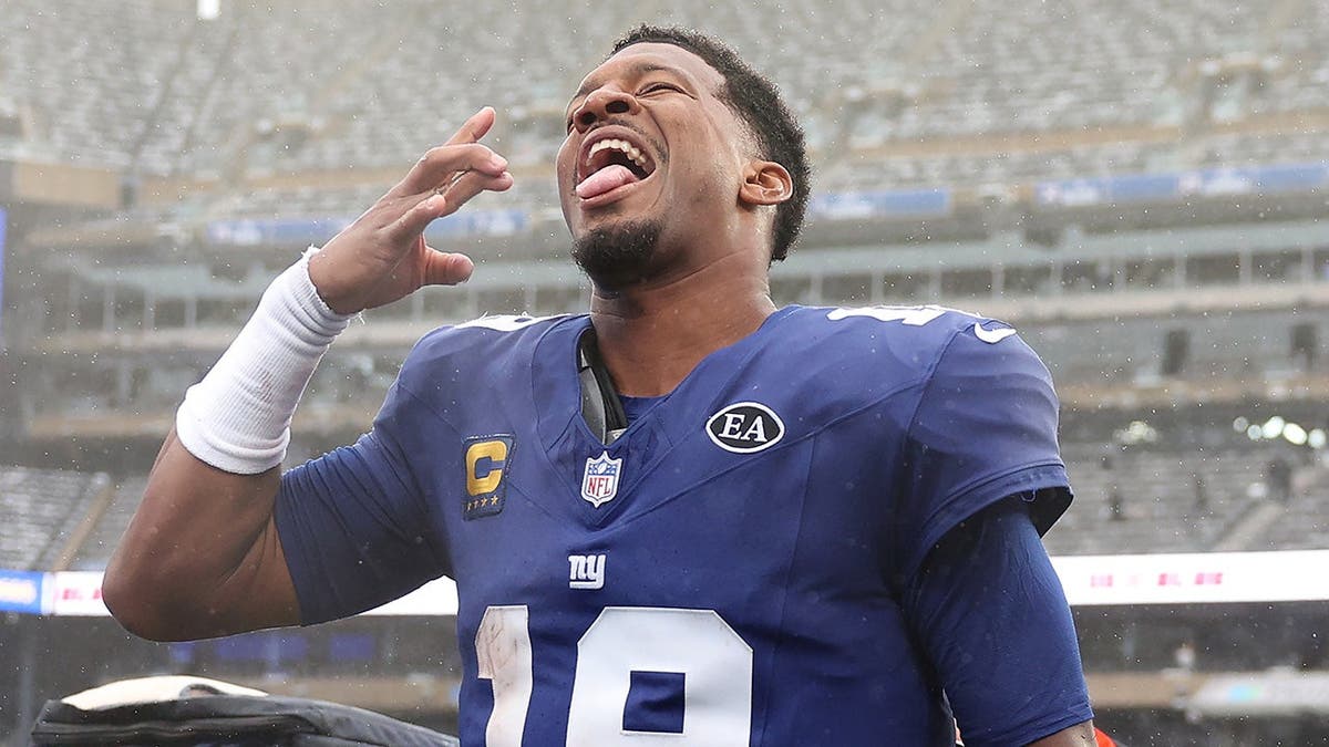 Jameis Winston, wearing Giants No. 19, celebrates a win at MetLife Stadium.