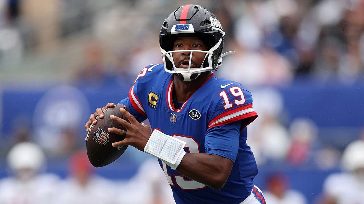 Jameis Winston scrambles with the ball during the Giants game against Arizona Cardinals.