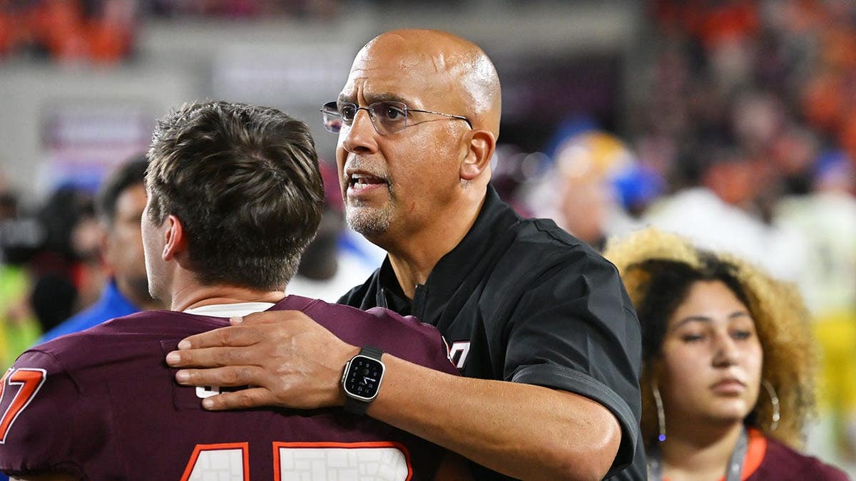 Virginia Tech head coach James Franklin talks to kicker John Love after a game at Lane Stadium.