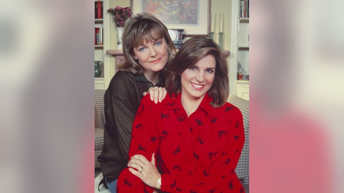 Jane Curtin as Allie Lowell and Susan Saint James as Kate McArdle pose together in a living room.