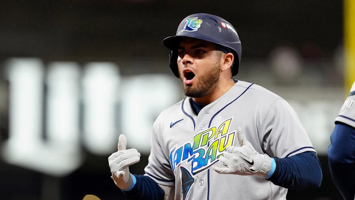 Jonathan Aranda reacts after hitting an RBI single during Game Four of the ALCS.