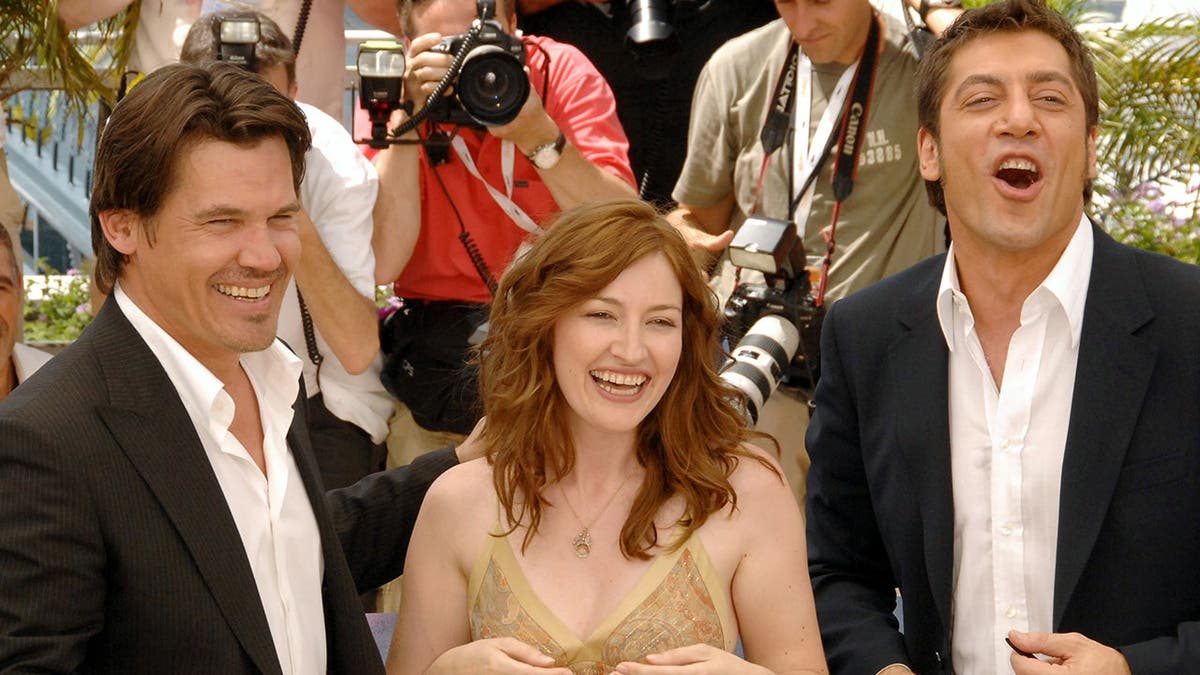 Josh Brolin stands with Kelly Macdonald and Javier Bardem at a photocall.