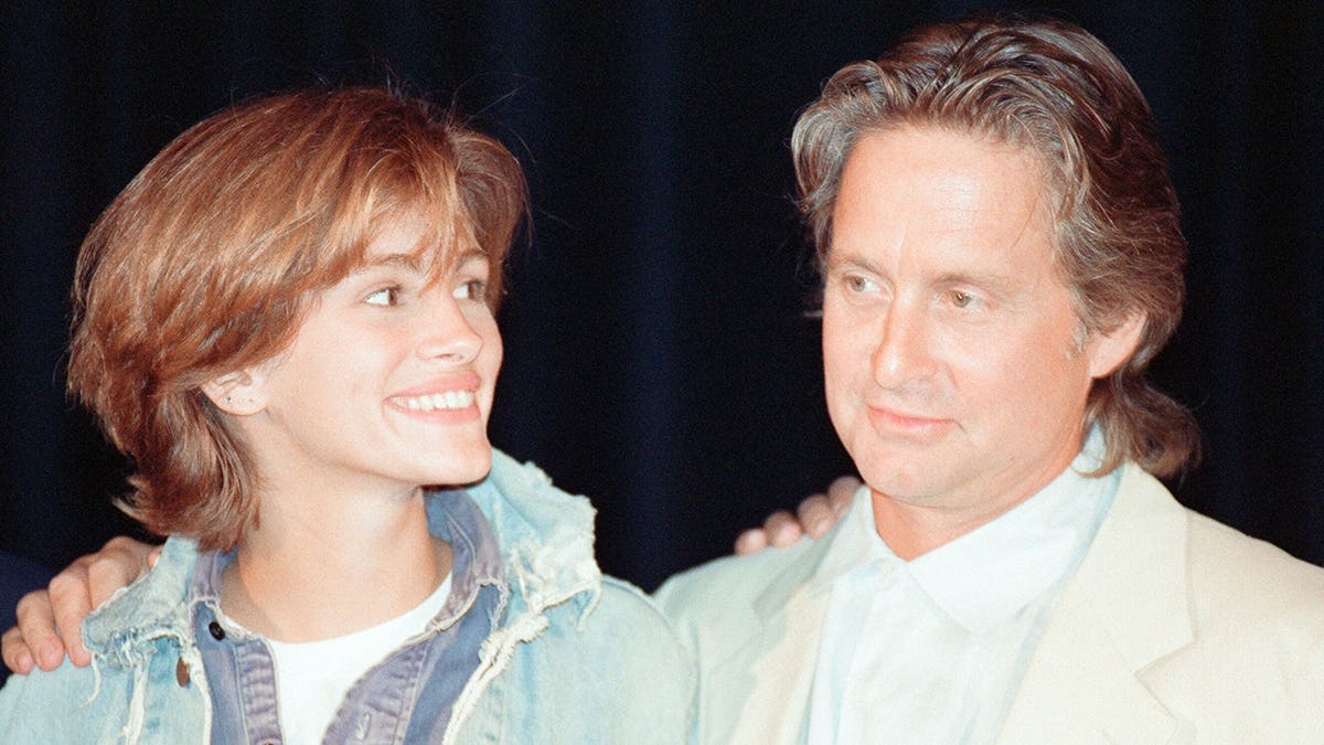 Julia Roberts and Michael Douglas stand together at the Deauville American Film Festival.