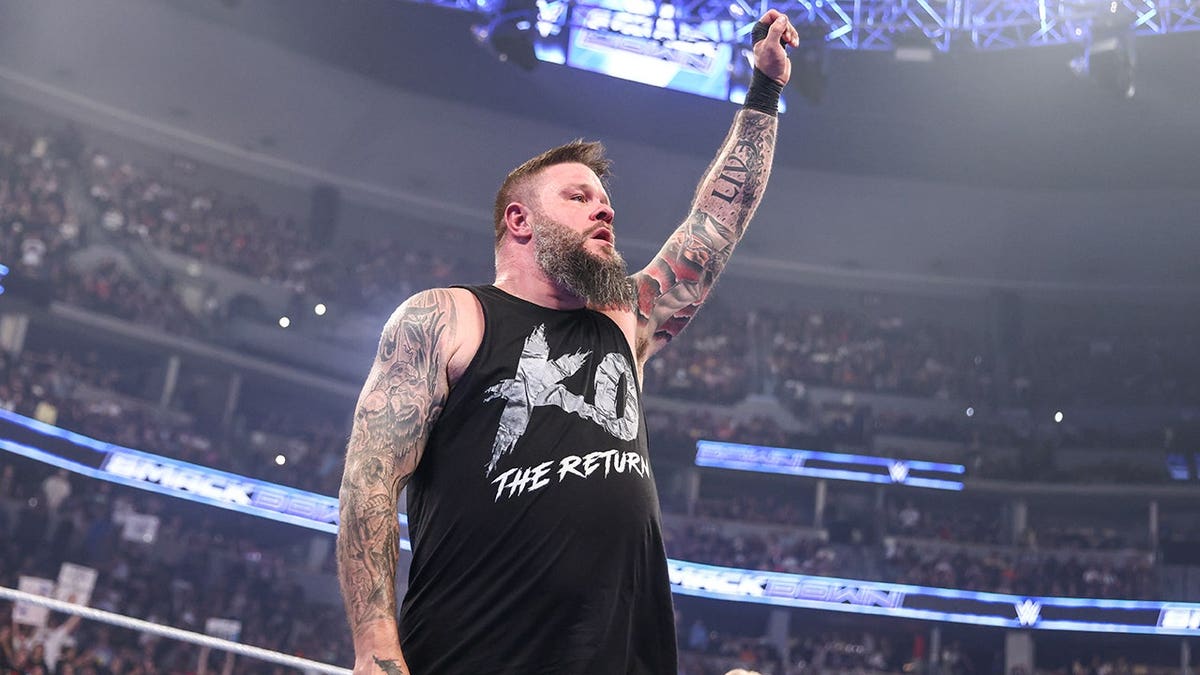 Kevin Owens celebrates his win during SmackDown at Ball Arena.