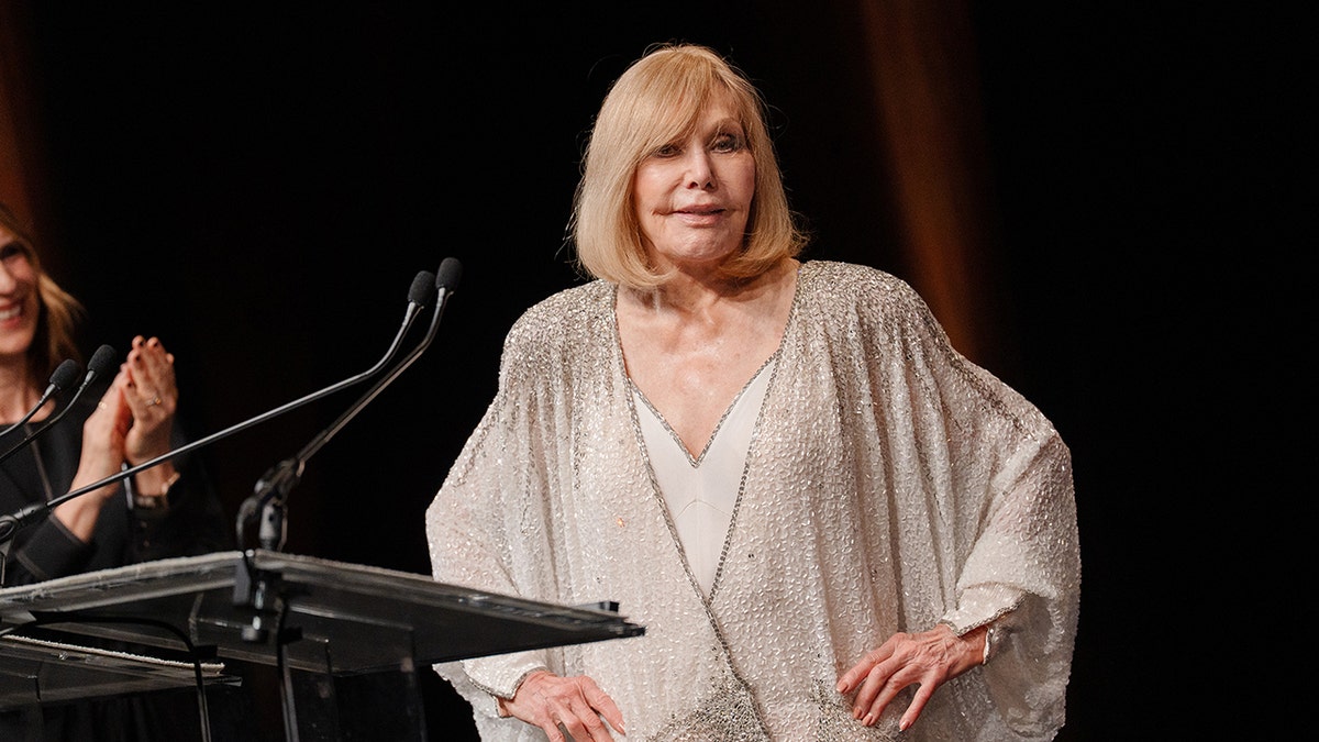 Kim Novak poses after receiving an Icon Award at a film festival in Deauville, France.