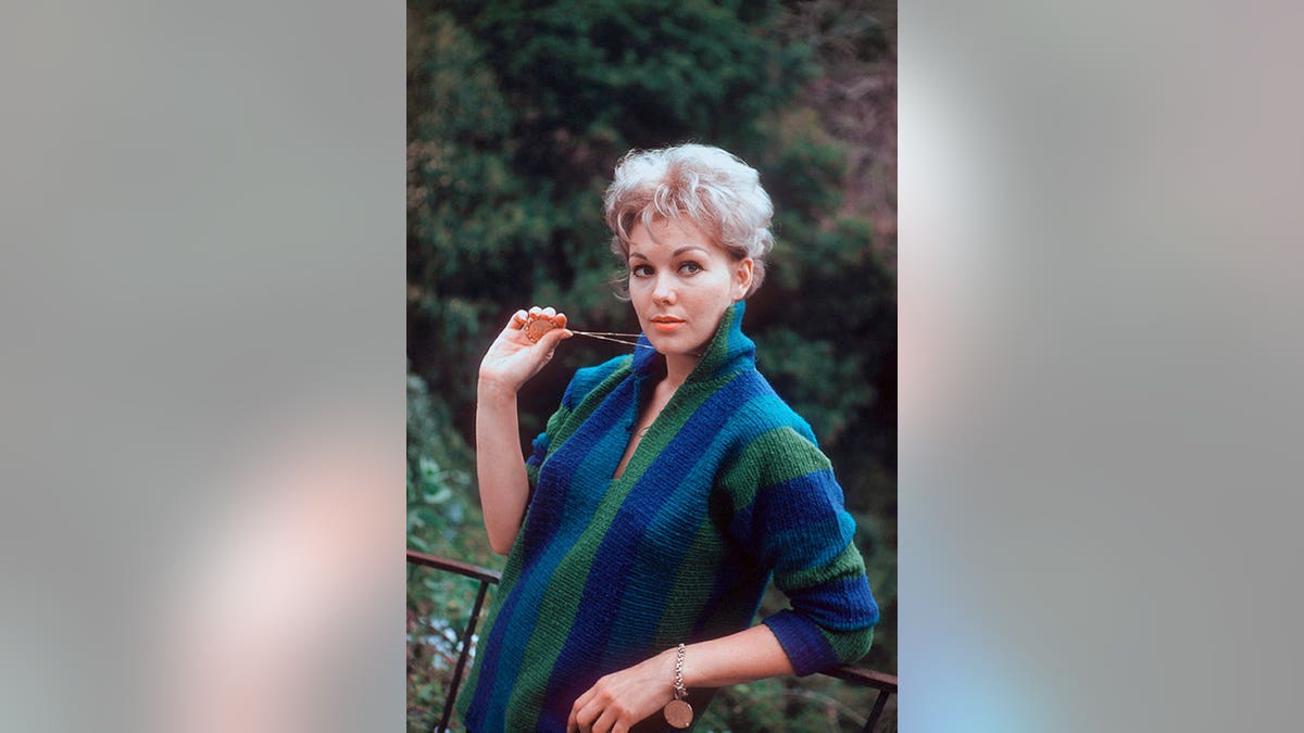 Kim Novak poses during a portrait session at home.