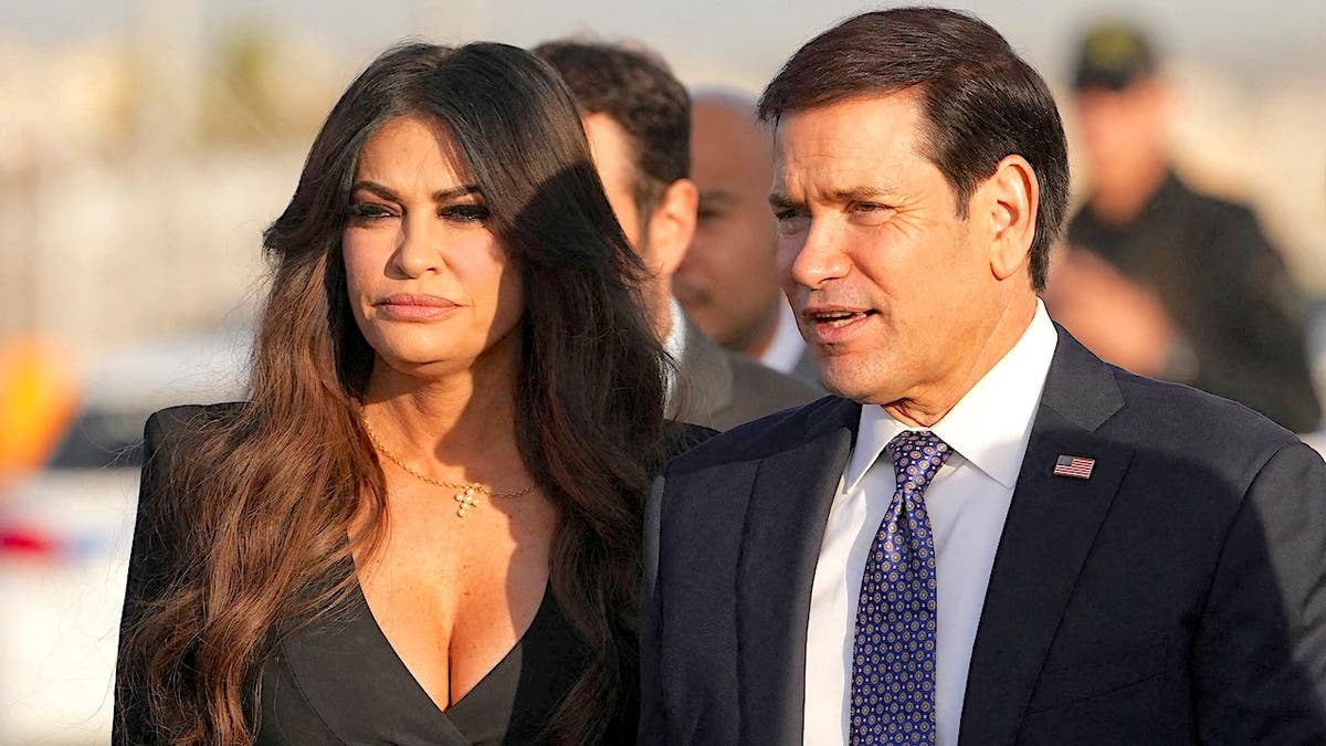 Secretary of State Marco Rubio and Ambassador Kimberly Guilfoyle board a plane at Athens airport.