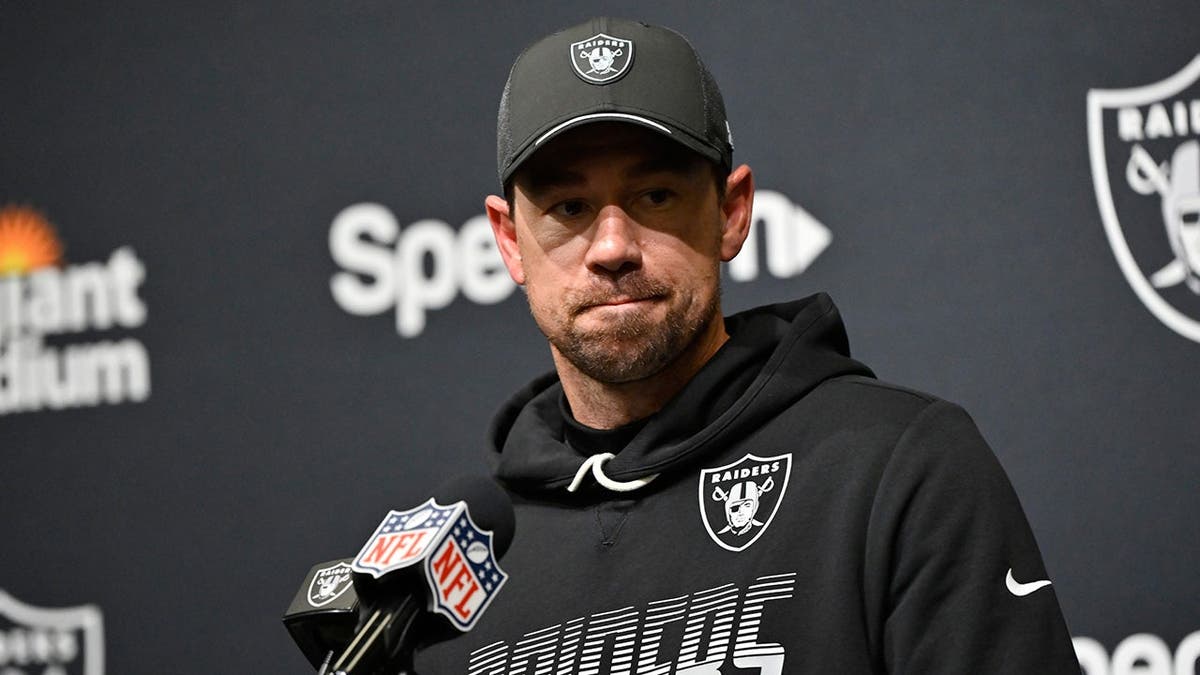 Klint Kubiak, Las Vegas Raiders head coach, talks to reporters.