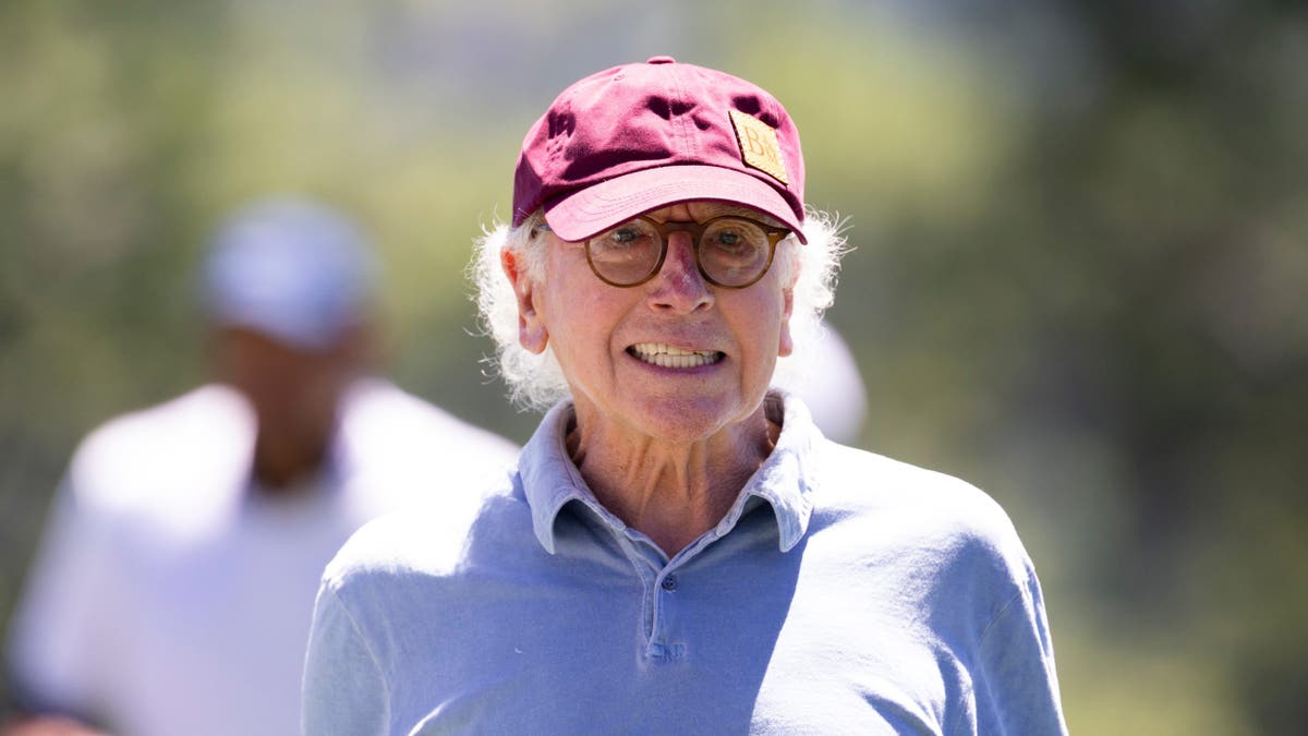 Larry David walks off the green at the 14th hole.