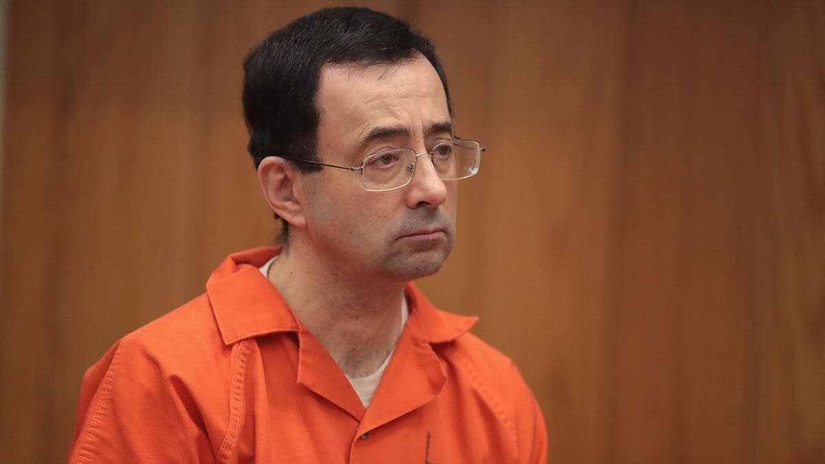 Larry Nassar stands in court during his sentencing in Charlotte, Mich.