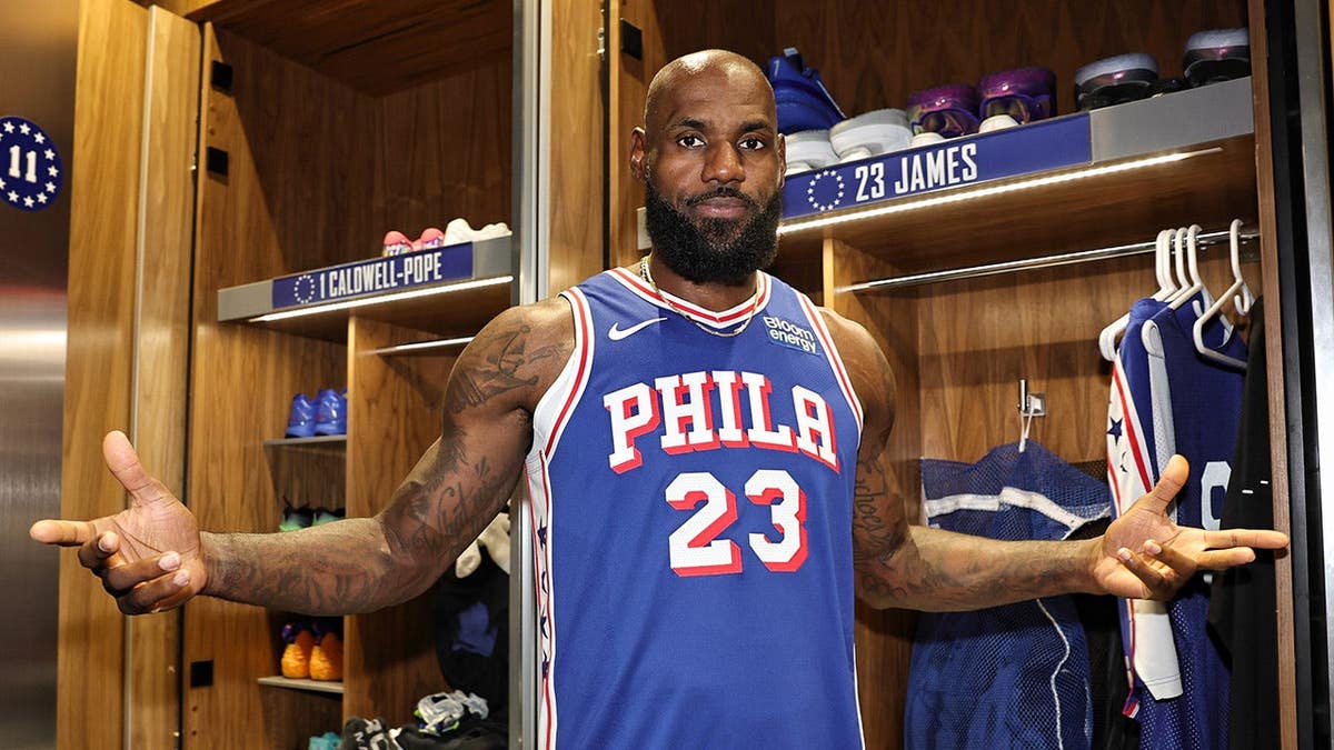LeBron James sits in the locker room during NBA media day.