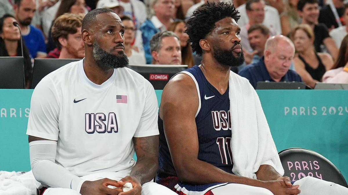 LeBron James and Joel Embiid of Team USA look on during the men's gold medal game against France.