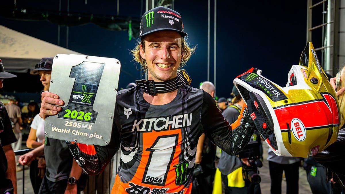 Levi Kitchen holds his 2026 Monster Energy SMX 250 Class World Championship trophy