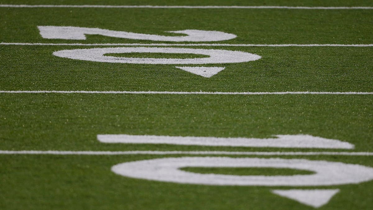 Liberty Flames turf field painted with numbers at Williams Stadium.