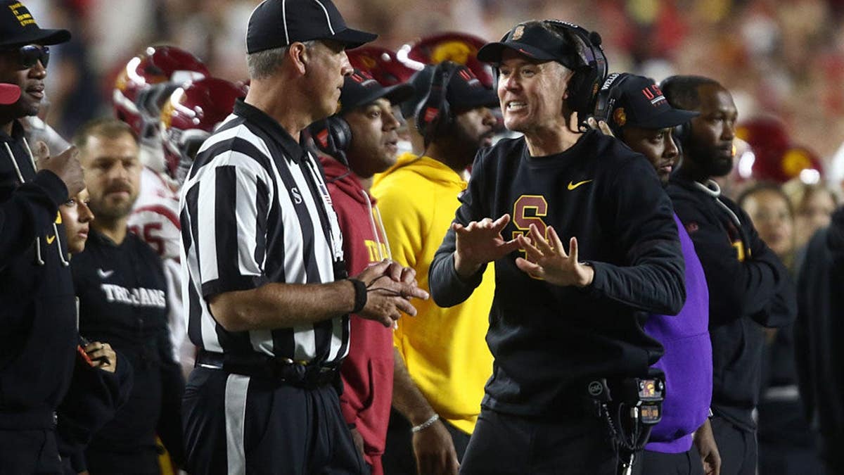 Lincoln Riley argues a call on the sideline during an NCAA football game.
