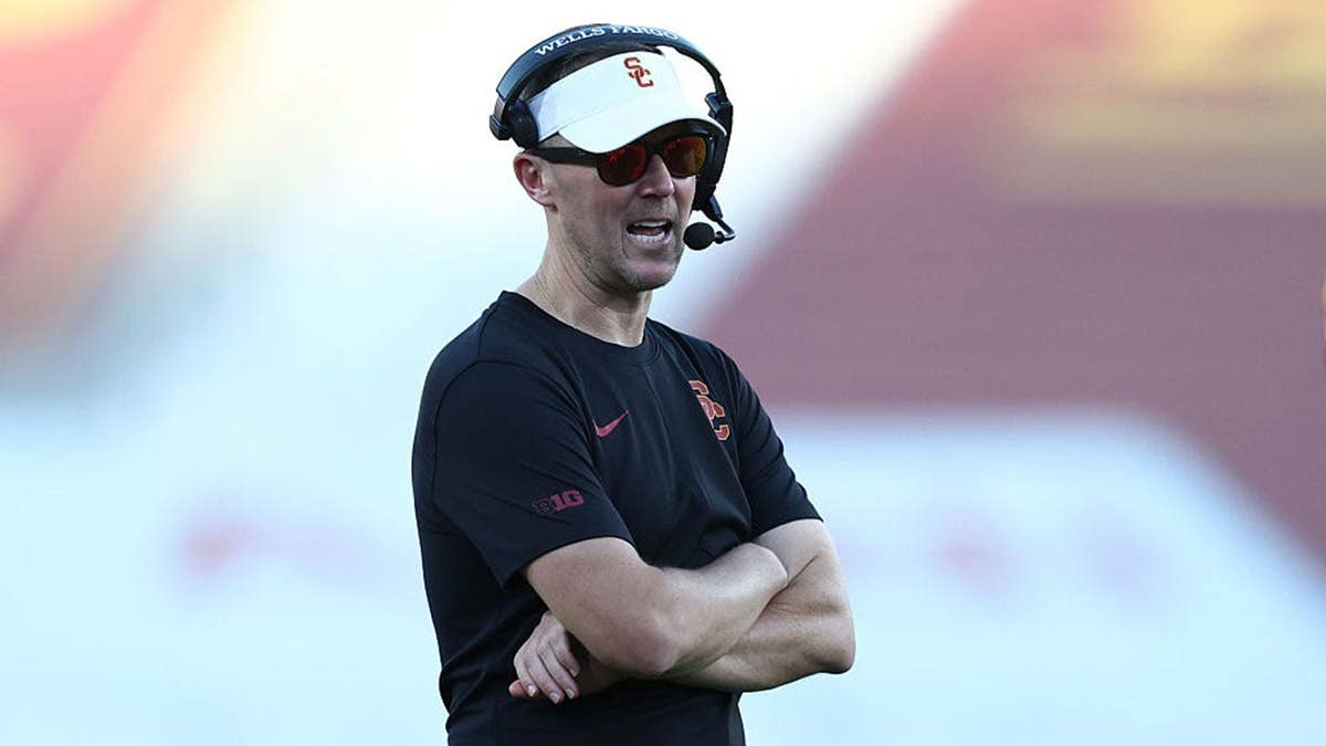 Lincoln Riley stands on the sideline during a game at Los Angeles Memorial Coliseum.